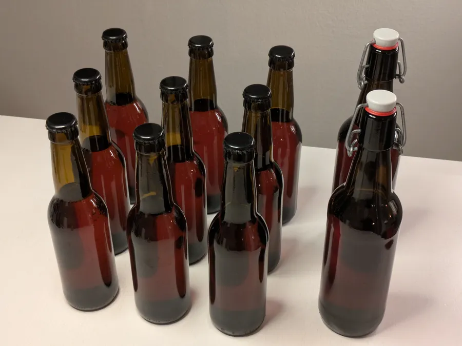 11 brown glass bottles, 9 33cl, 2 50cl, with cherry and strawberry mead.