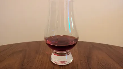 Dark woke mead in a Glencairnglas.