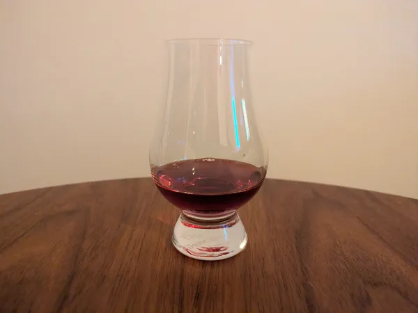 Dark woke mead in a Glencairnglas.