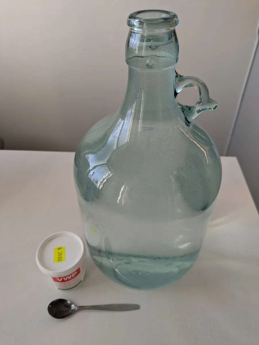 Demijohn with sterilize water.