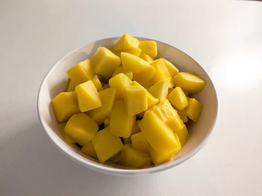 Mango pieces in a bowl.